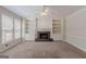 Spacious living room with fireplace, built-in bookshelves and ample natural light at 901 Chadwick Park Dr, Lawrenceville, GA 30045