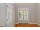 Bright room with hardwood floors and double doors providing access to the outdoors at 901 Chadwick Park Dr, Lawrenceville, GA 30045
