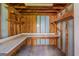 Interior view of shed featuring plywood walls, shelving and a white work counter at 901 Chadwick Park Dr, Lawrenceville, GA 30045