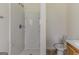 Bright bathroom featuring a shower with white tiling and modern fixtures at 1006 Eagle Vw, Lawrenceville, GA 30044