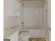 Bathroom features shower and bathtub combination, as well as granite countertop and vanity at 1006 Eagle Vw, Lawrenceville, GA 30044