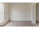 Bright bedroom with neutral carpet, closet, and a window for natural light at 1006 Eagle Vw, Lawrenceville, GA 30044