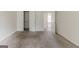 Bedroom view showcasing neutral walls, carpet, and doorways to other rooms at 1006 Eagle Vw, Lawrenceville, GA 30044