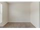 Bright empty bedroom featuring neutral walls, carpet and a side window at 1006 Eagle Vw, Lawrenceville, GA 30044
