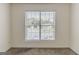 Bright bedroom featuring neutral walls, carpet and a window with blinds at 1006 Eagle Vw, Lawrenceville, GA 30044