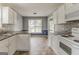 Spacious kitchen featuring cabinets, appliances, and a breakfast nook with natural light at 1006 Eagle Vw, Lawrenceville, GA 30044