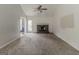Open living room with a cozy fireplace, neutral carpet, and access to backyard at 1006 Eagle Vw, Lawrenceville, GA 30044