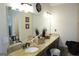 Bright bathroom with dual sinks, a large mirror, and plenty of counter space at 11940 Wexford Club Dr, Roswell, GA 30075