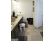 Neutral bathroom with dual sinks, granite countertops, and beige tile flooring at 11940 Wexford Club Dr, Roswell, GA 30075
