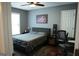 Inviting bedroom with natural light, grey color scheme, and wood laminate flooring at 11940 Wexford Club Dr, Roswell, GA 30075