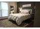 Cozy bedroom with queen bed, soft rug and mirror at 11940 Wexford Club Dr, Roswell, GA 30075