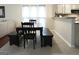 Casual dining area with a wooden table and bench seating adjacent to the kitchen at 11940 Wexford Club Dr, Roswell, GA 30075