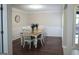 Inviting dining room with a wooden table and seating for six, complemented by decorative wall trim at 11940 Wexford Club Dr, Roswell, GA 30075