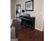Welcoming entryway features a piano with hardwood floors and a view into another living space at 11940 Wexford Club Dr, Roswell, GA 30075