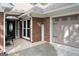 Charming brick home exterior showcasing a welcome sign and garage, highlighting curb appeal at 11940 Wexford Club Dr, Roswell, GA 30075