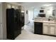Open kitchen with stainless steel appliances and a view to the living room at 11940 Wexford Club Dr, Roswell, GA 30075