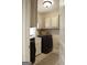 Laundry room featuring a black washer and dryer set, with a view through a door at 11940 Wexford Club Dr, Roswell, GA 30075