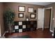 Bright office space with wood laminate flooring, cube storage and wall art at 11940 Wexford Club Dr, Roswell, GA 30075
