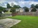 Large, fenced backyard with a concrete patio, perfect for outdoor entertaining and relaxation at 2424 Saint Andrews Rdg, College Park, GA 30337