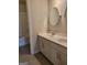 Bathroom vanity with double sinks, white cabinets and round mirrors at 2424 Saint Andrews Rdg, College Park, GA 30337