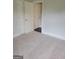Bright bedroom featuring plush carpet, a closet, and neutral paint at 2424 Saint Andrews Rdg, College Park, GA 30337