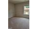 Bedroom featuring neutral walls, carpet, and a bright window at 2424 Saint Andrews Rdg, College Park, GA 30337