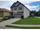 Beautiful home with well-maintained lawn, a two-car garage, and gray exterior at 2424 Saint Andrews Rdg, College Park, GA 30337