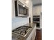Modern kitchen featuring stainless steel appliances, granite countertops, and white cabinetry at 2424 Saint Andrews Rdg, College Park, GA 30337