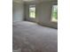 Spacious main bedroom featuring neutral paint and carpet at 2424 Saint Andrews Rdg, College Park, GA 30337
