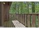 Outdoor balcony overlooks a lush green forest, creating a peaceful retreat and natural backdrop at 36 Cobblestone Crk, Peachtree City, GA 30269