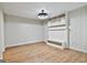 Finished basement space with modern light fixture and built-in shelving at 36 Cobblestone Crk, Peachtree City, GA 30269