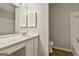 Bathroom features a sleek vanity, toilet, mirror and shower-tub combo, providing a comfortable and functional space at 36 Cobblestone Crk, Peachtree City, GA 30269