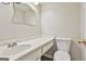 Bathroom featuring a sleek sink vanity, toilet, and mirror, offering a functional and stylish space for daily routines at 36 Cobblestone Crk, Peachtree City, GA 30269