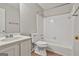 Well-lit bathroom features a shower-tub combo, toilet, and a single sink vanity with ample counter space at 36 Cobblestone Crk, Peachtree City, GA 30269