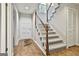 Foyer featuring carpeted stairs, hard wood flooring and a view into the home at 36 Cobblestone Crk, Peachtree City, GA 30269