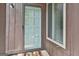 Close up of the front door with a storm door and a window on the side at 36 Cobblestone Crk, Peachtree City, GA 30269