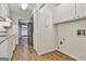 Bright kitchen with white cabinets and wood-look flooring at 36 Cobblestone Crk, Peachtree City, GA 30269