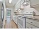 Kitchen with white cabinets and modern appliances at 36 Cobblestone Crk, Peachtree City, GA 30269
