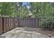 Private patio area with privacy fence and mature landscaping creating a tranquil outdoor space at 36 Cobblestone Crk, Peachtree City, GA 30269
