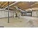 Unfinished basement with concrete flooring, exposed piping, and staircase at 936 Bo Bo Banks Rd, Grantville, GA 30220