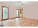 Inviting bedroom features hardwood floors, built-in shelves, and large windows at 936 Bo Bo Banks Rd, Grantville, GA 30220