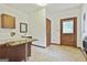 Mud room with utility sink, exterior door, and tile flooring at 936 Bo Bo Banks Rd, Grantville, GA 30220