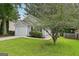Single Gathering home with well-maintained lawn, landscaping and attached garage at 1528 Wembley Dr, Douglasville, GA 30134