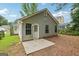 Exterior view of the home with vinyl siding, a concrete patio, and a backyard at 1528 Wembley Dr, Douglasville, GA 30134