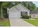 Charming single Gathering home with a well-maintained lawn and attached garage at 1528 Wembley Dr, Douglasville, GA 30134