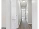 Hallway with hardwood floors, recessed lighting, and doors leading to various rooms in the house at 1528 Wembley Dr, Douglasville, GA 30134