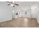 Open concept living space with updated lighting, a view of the kitchen and modern flooring at 1528 Wembley Dr, Douglasville, GA 30134