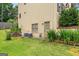 Lush green lawn and landscaped beds on the back exterior of the home at 2864 Wyndcliff Ct, Marietta, GA 30066