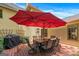 Outdoor patio with a table, seating, grill, and large umbrella, creating an inviting space for backyard gatherings at 2864 Wyndcliff Ct, Marietta, GA 30066