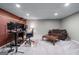 Finished basement featuring a comfortable sofa and a dedicated workstation for work or creative projects at 2864 Wyndcliff Ct, Marietta, GA 30066